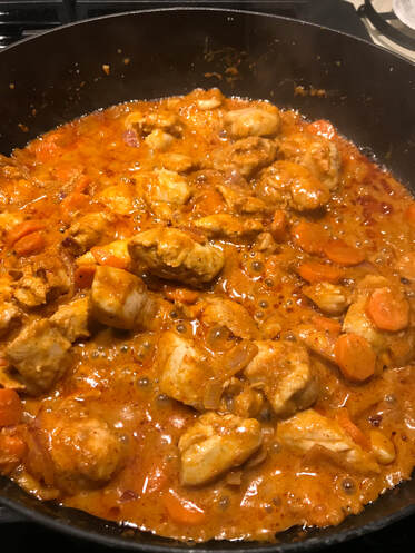 In the process of cooking: Spicy Chicken Tom Yum Soup: A delicious and easy at-home recipe for restaurant-style Thai chicken curry, full of flavor and spice. 
